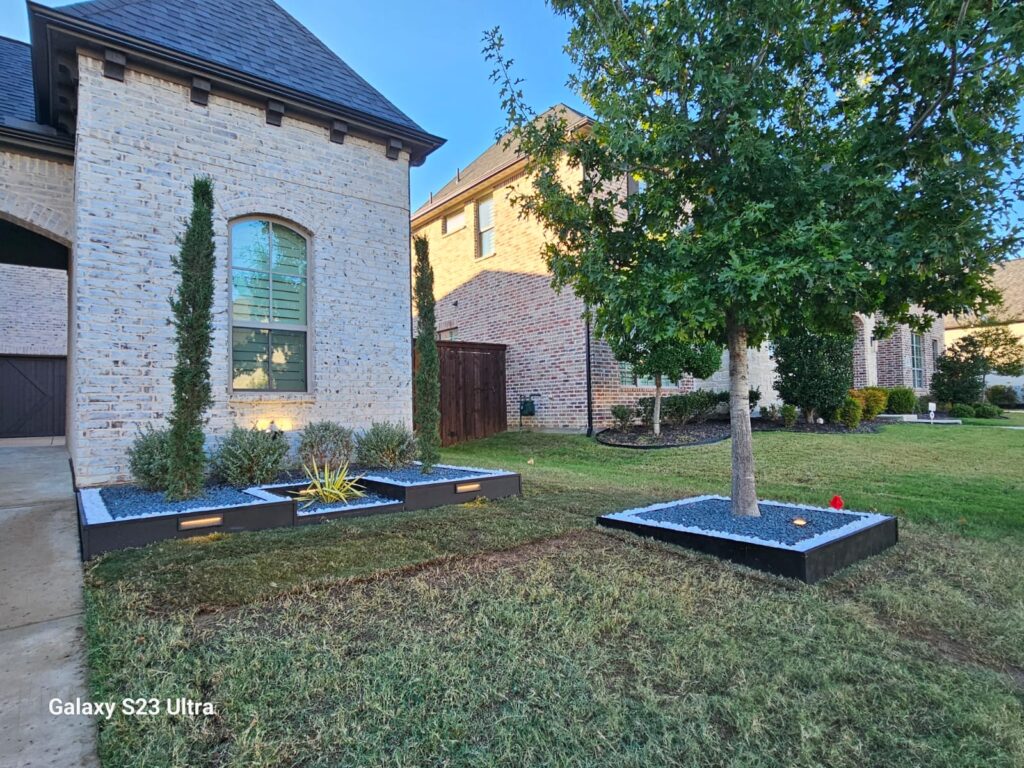 Landscaped yard with fresh plantings and mulch