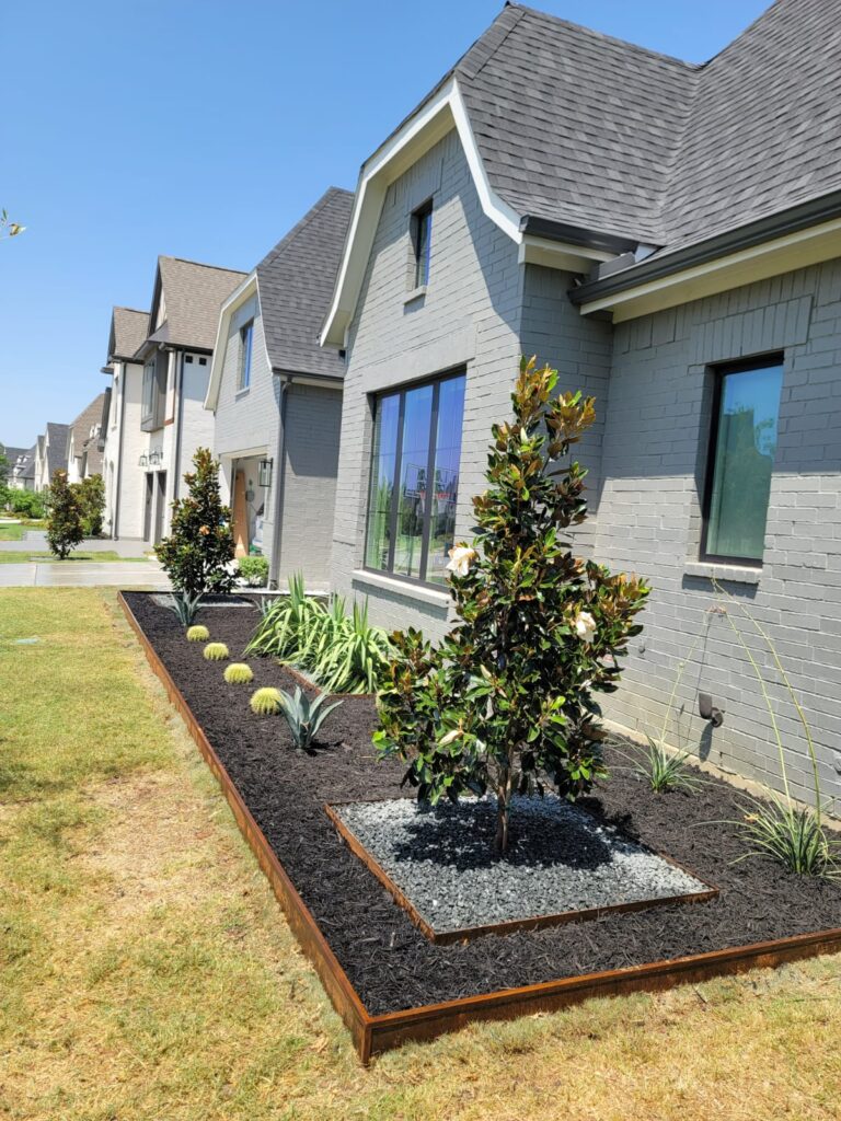 Front yard garden bed with shrubs