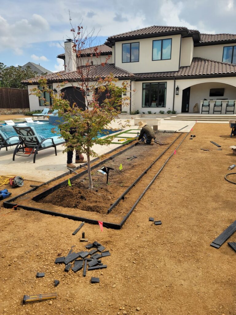 River-rock planting bed with agave plants